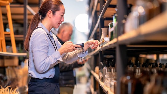 Ethical supply chain - woman at store checking products