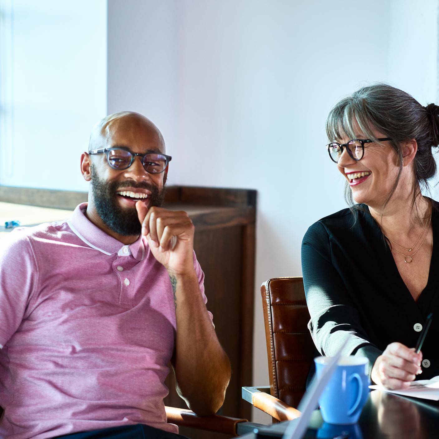 image of two people enjoying a conversation and smiling