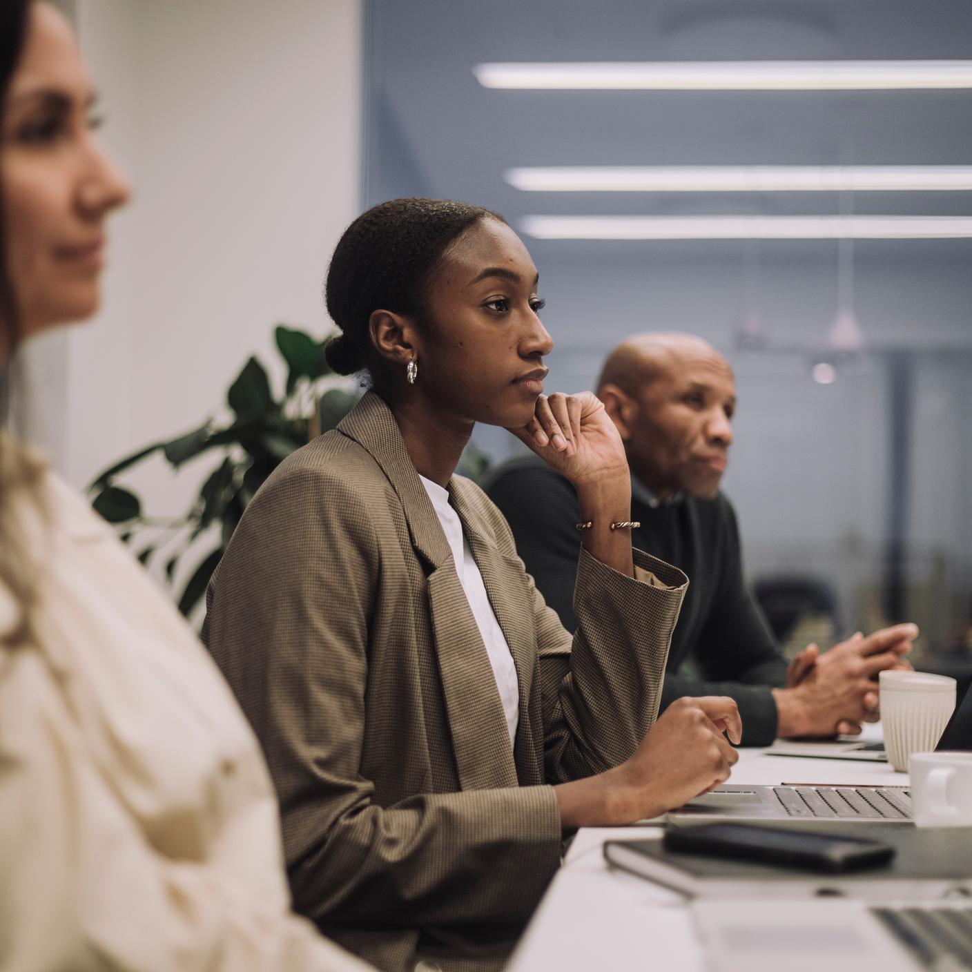 Standards that strengthen international trade - Multiracial male and female business colleagues working with dedication in office