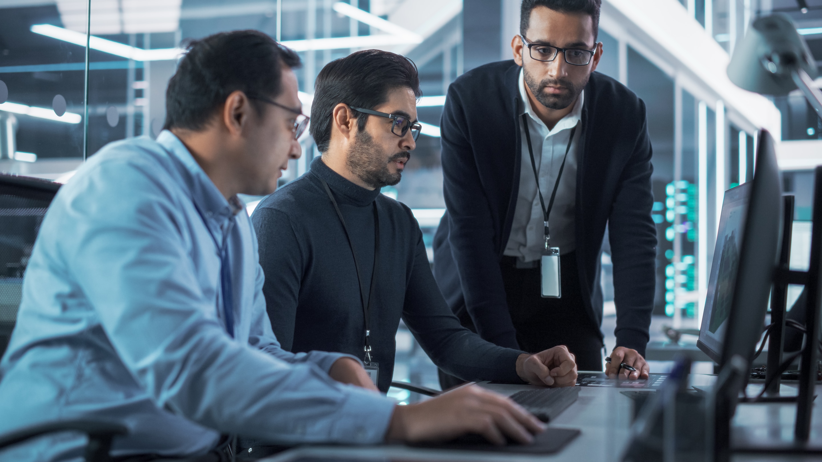 Colleagues in a meeting in front of a  computer